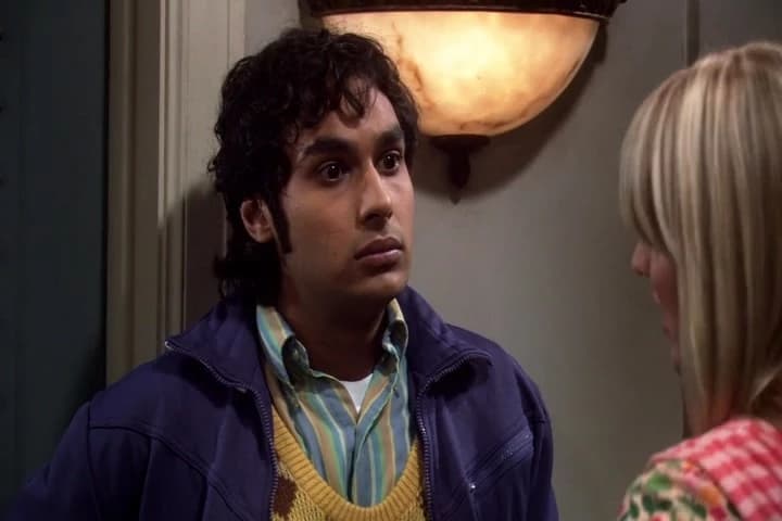 RAJESH <font color="#E86CE4">(IN VOICE-OVER)</font>:
She's standing very close to me.