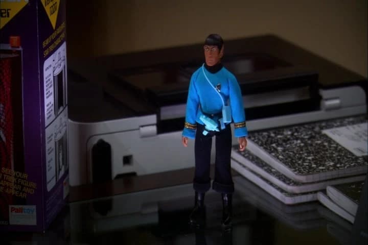 <i>Down here.</i>
<i>On your desk.</i>