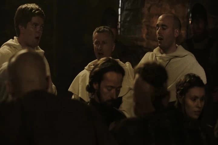 (SINGING HYMN)
